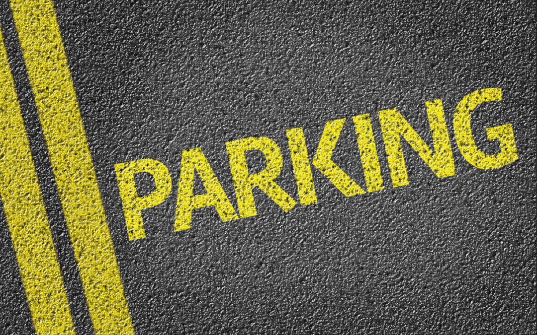 Parking Fines - asphalt marked with PARKING in yellow paint