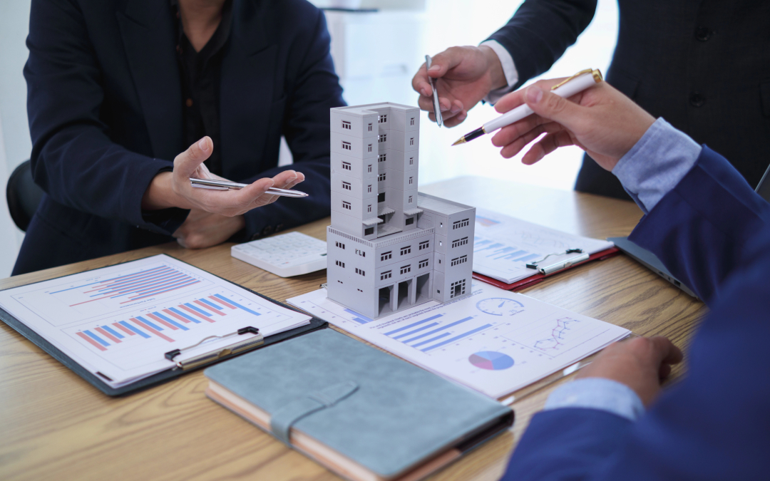 Educating the Condo Corporation - people at a desk with building model and paperwork