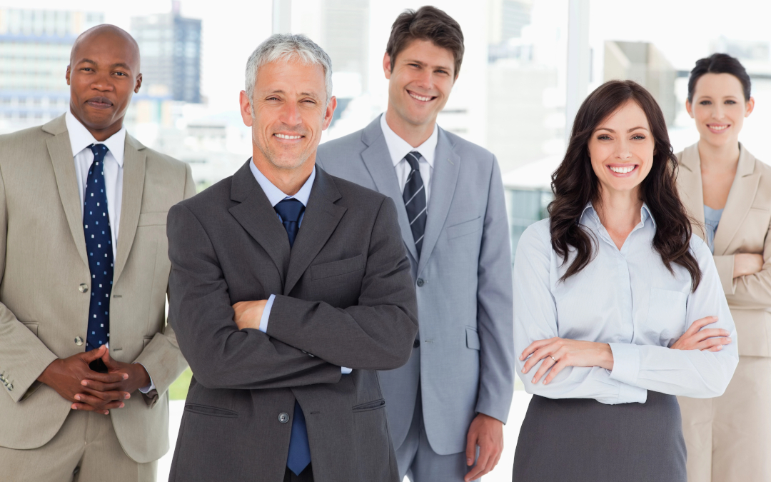 How a Professionally Managed Building Keeps You Safe - photo of a smiling professional business team